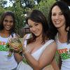 Ella Bella holds a bullfrog with Miss Earth finalists at Jhb Zoo